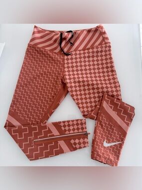 Nike Epic Lux Running Tights – Women’s Size L (Orange Pattern) small tear